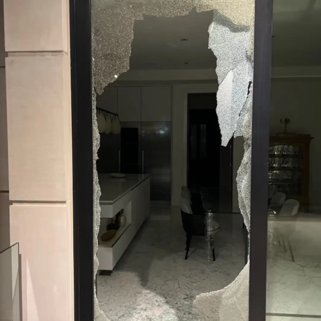 Smashed sliding door waiting for an emergency board-up in Toronto
